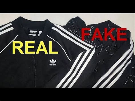 fake adidas hoodie vs real|genuine adidas jacket.